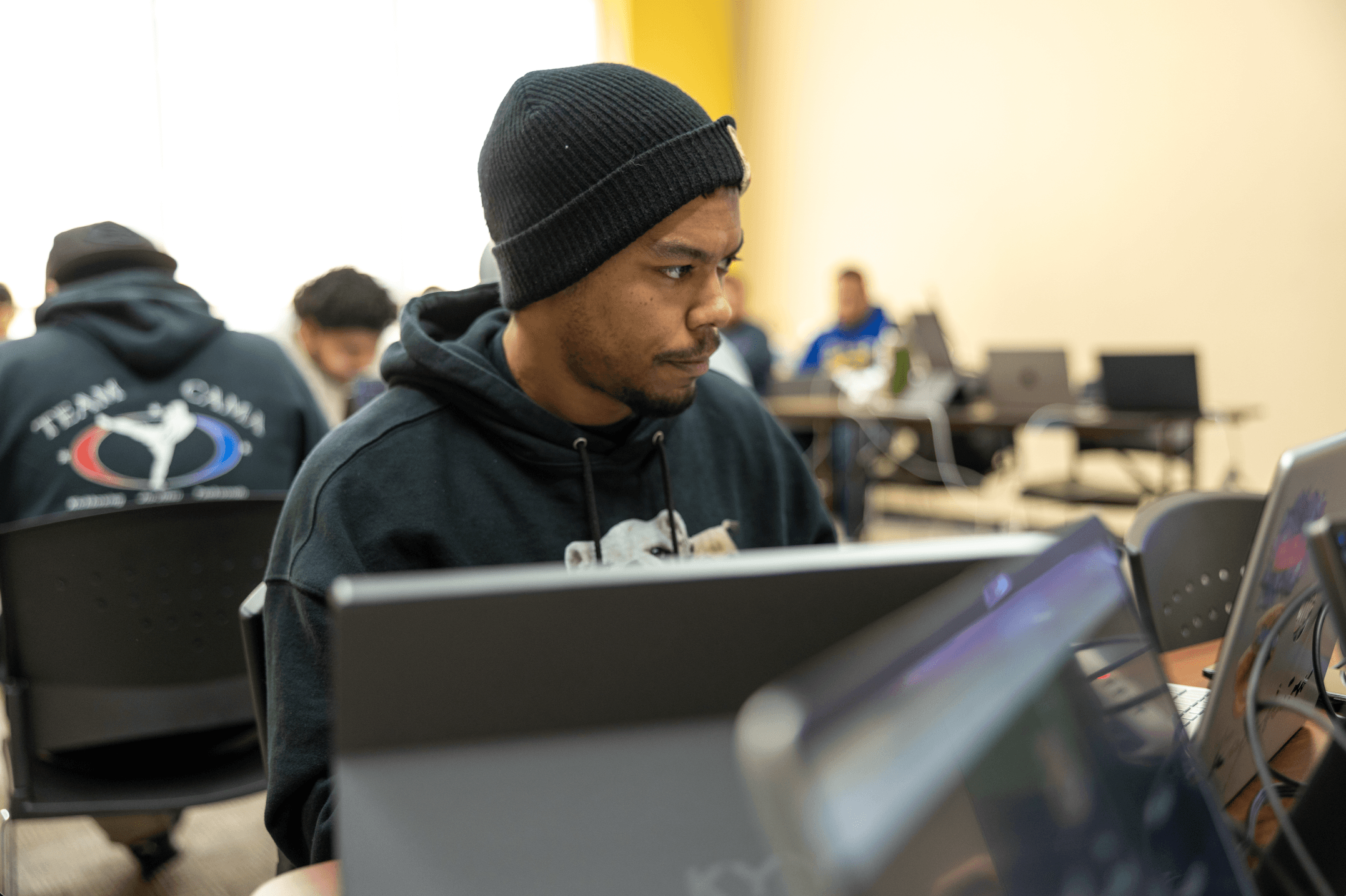 Isaiah Ferguson at work in a CodeStack Academy classroom